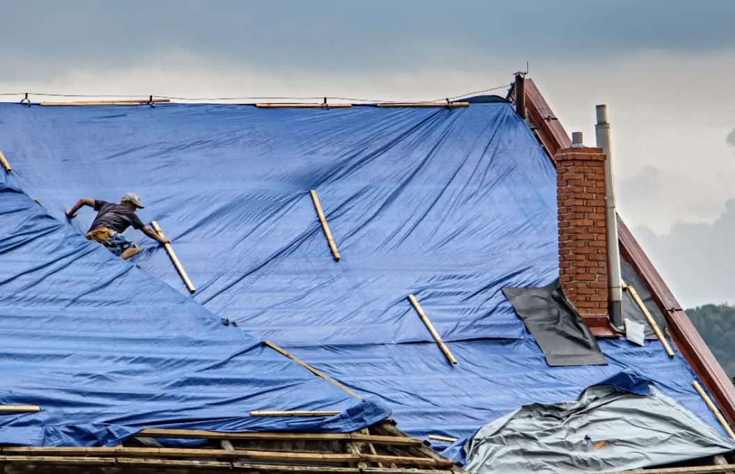 Emergency roof tarping and shrinkwrapping services